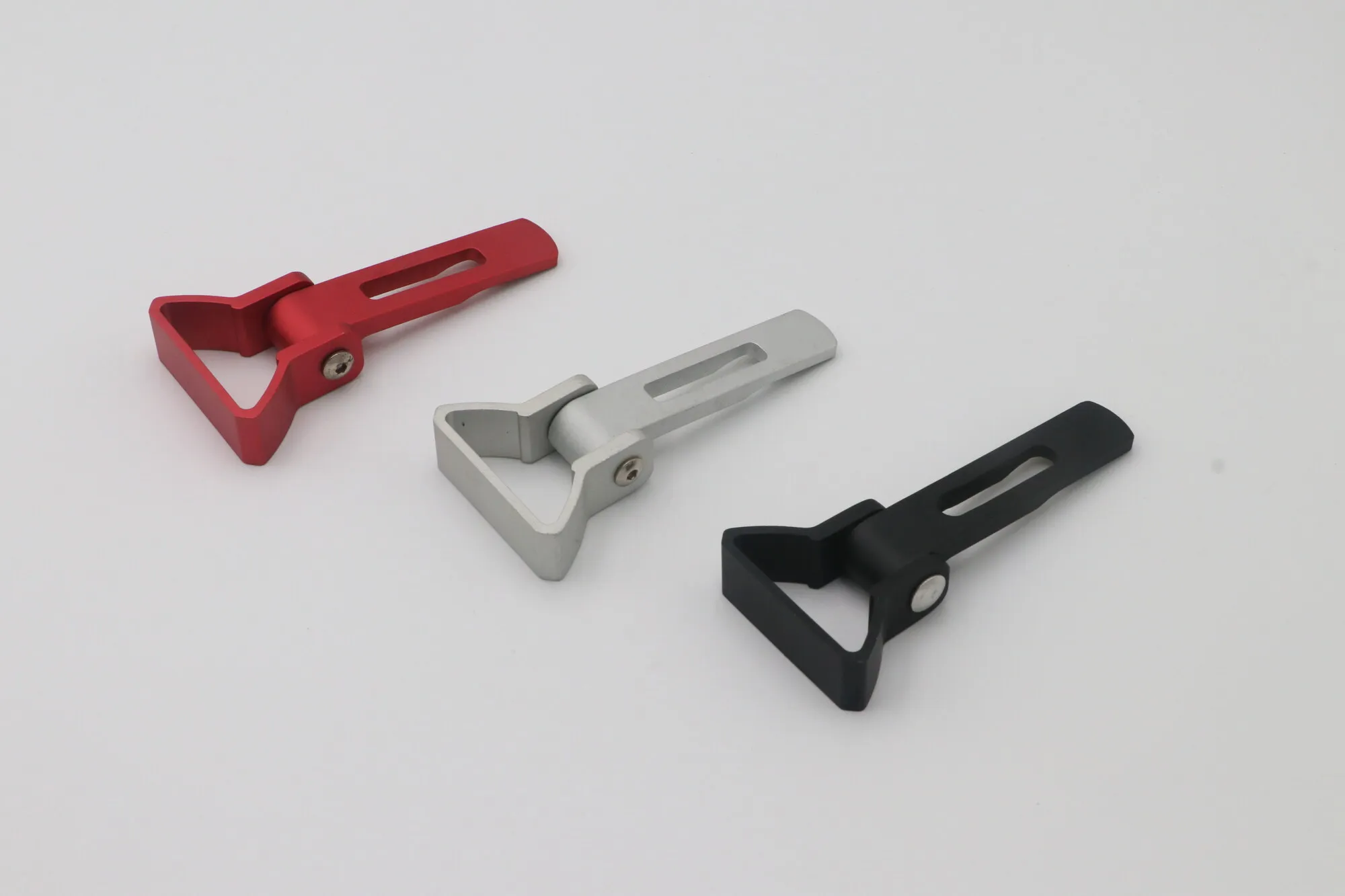 Set of machined aluminum clamp levers anodized in red, silver and black