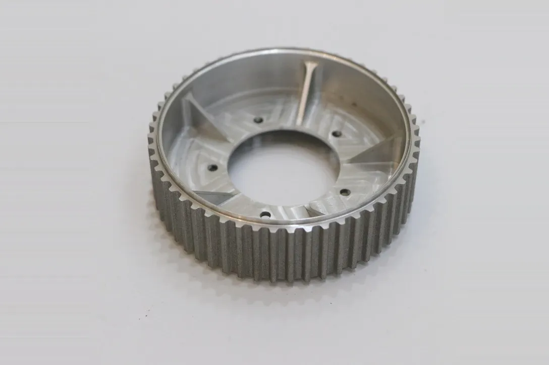 CNC machined toothed timing pulley in steel with bored hub
