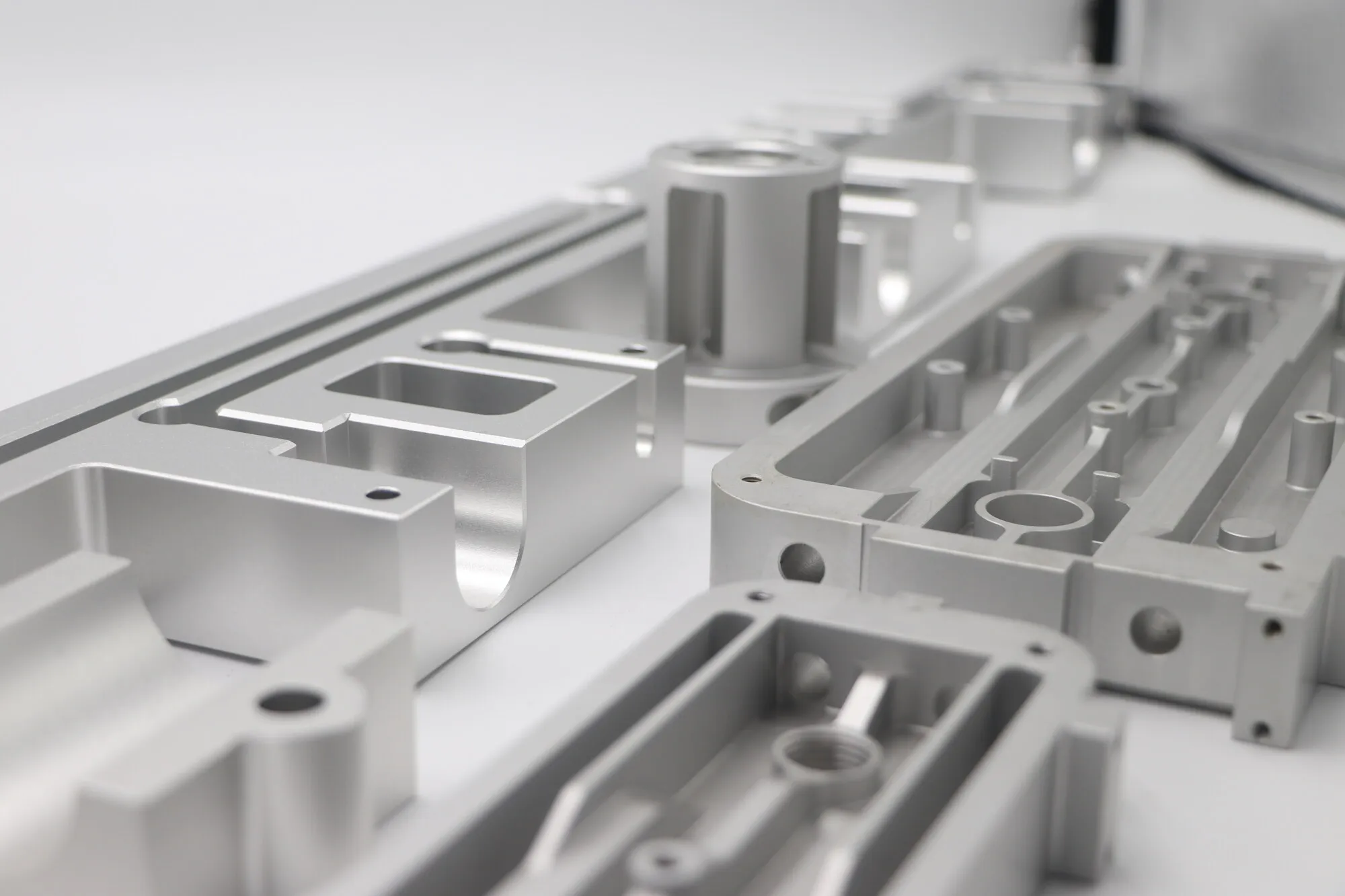 Close detail of milled pockets, bosses and bores on an aluminum machine frame